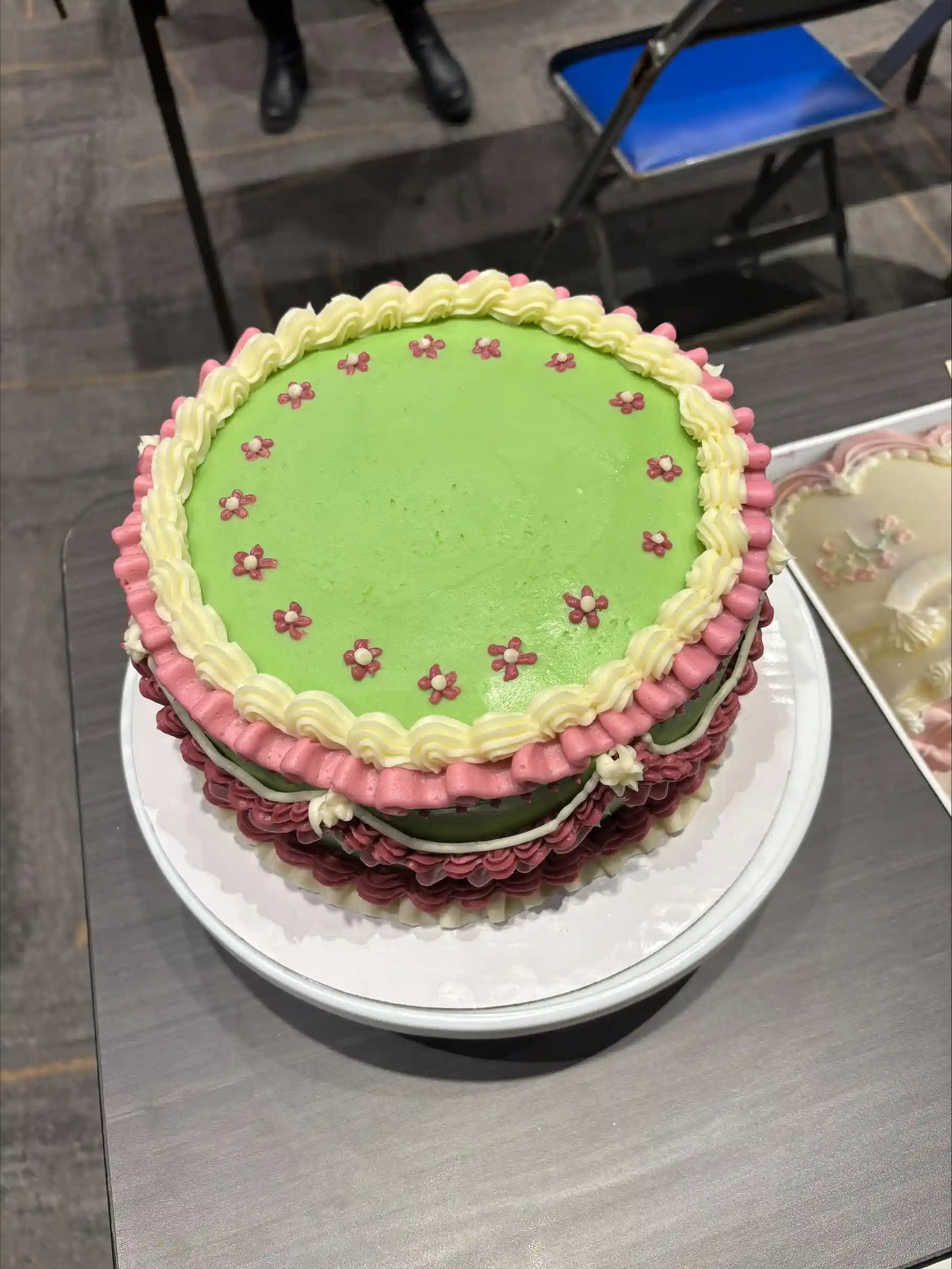 Cake decorated with green and pink frosting