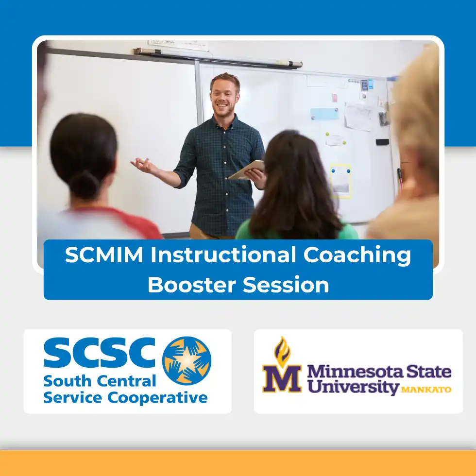 teacher standing in front of classroom presenting to students with whiteboard behind them.