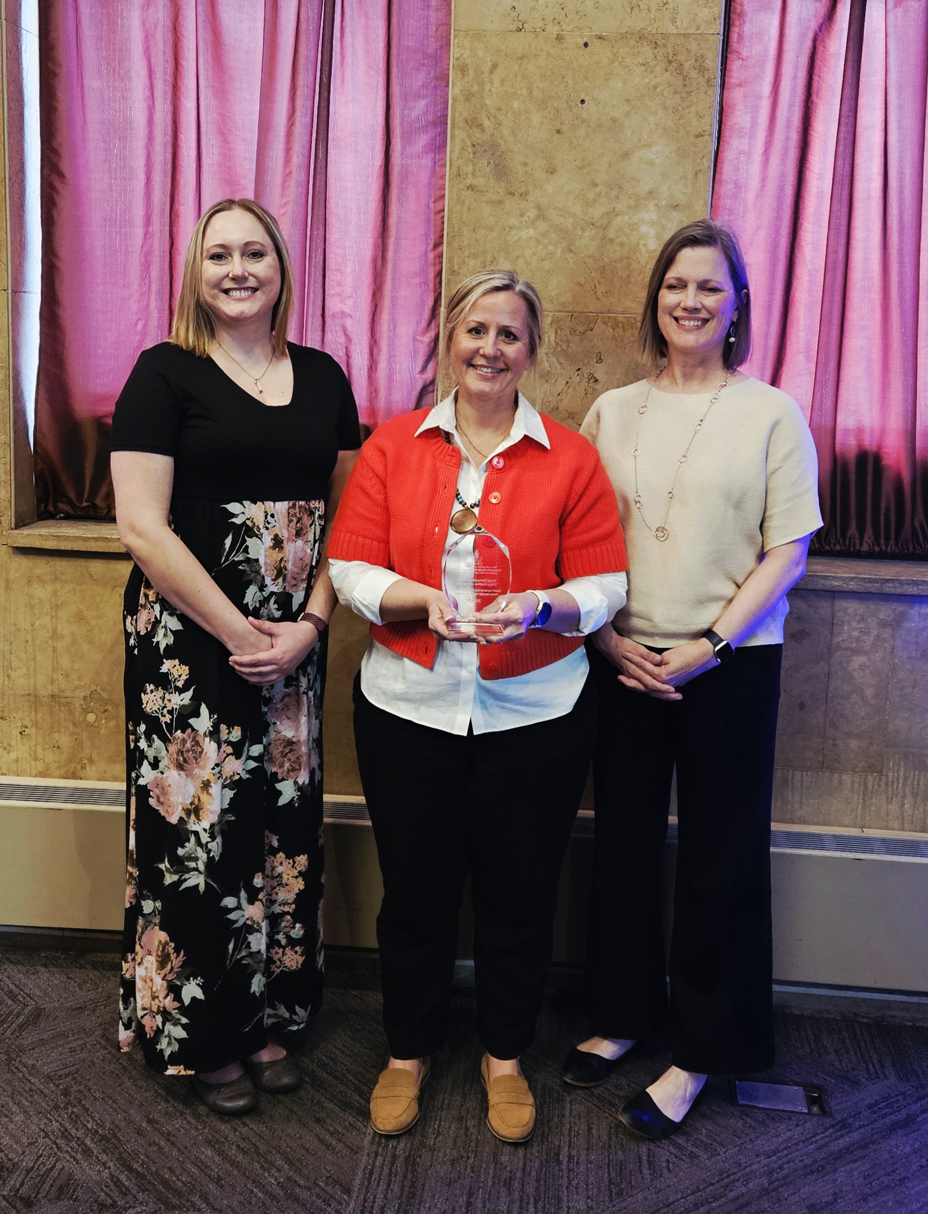 YMHN Team smiling with their award