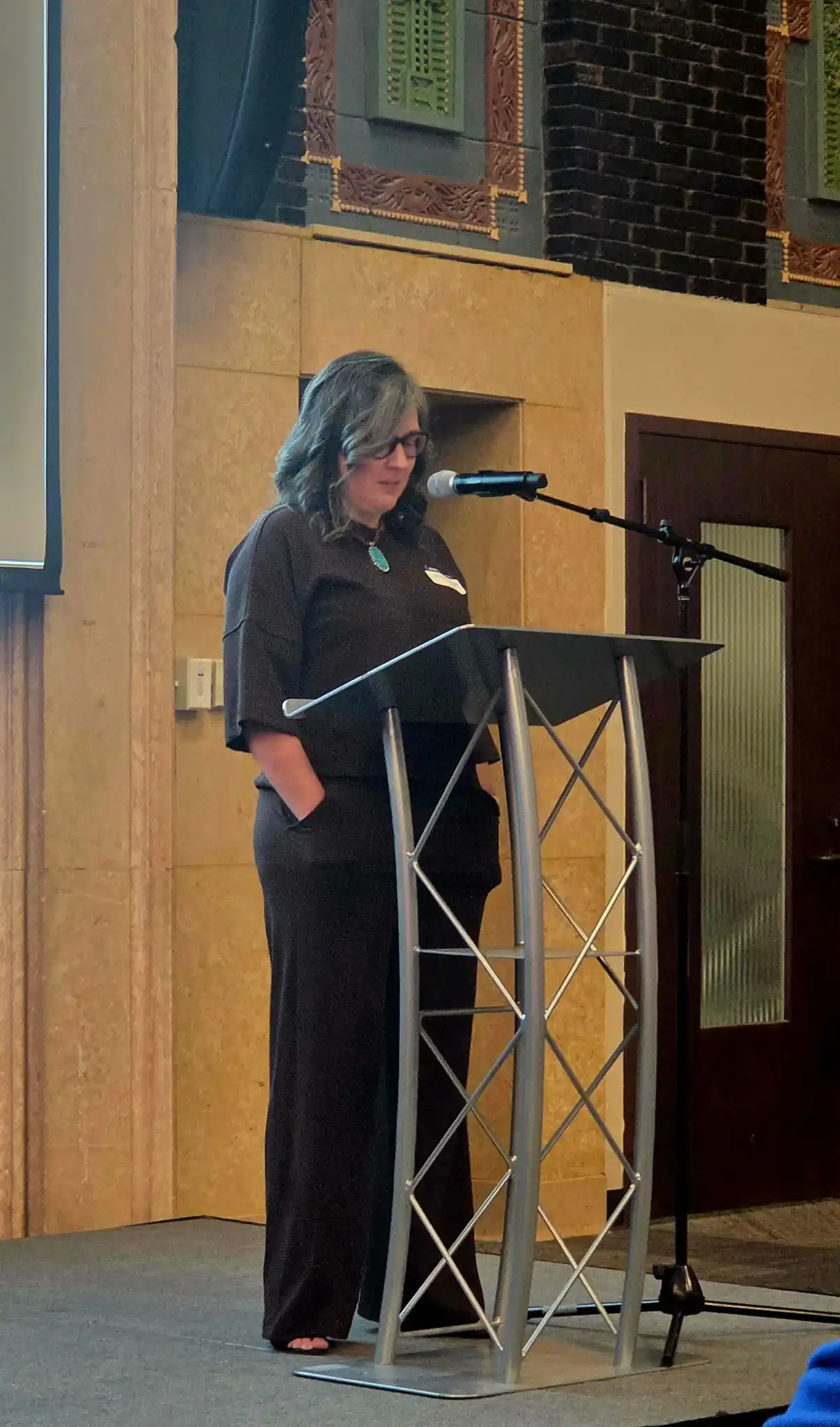 speaker at a podium during the event