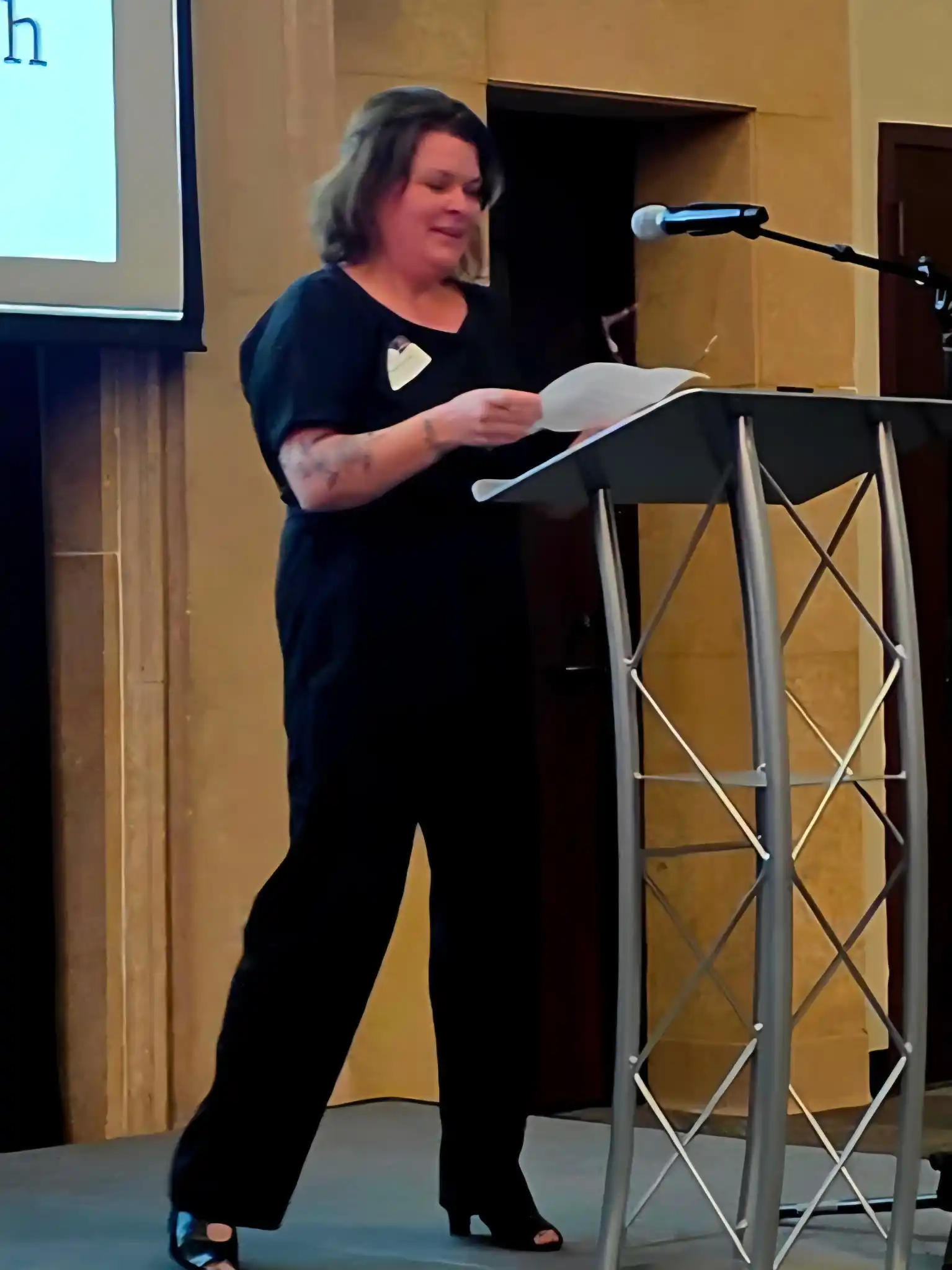 presenter standing at a podium