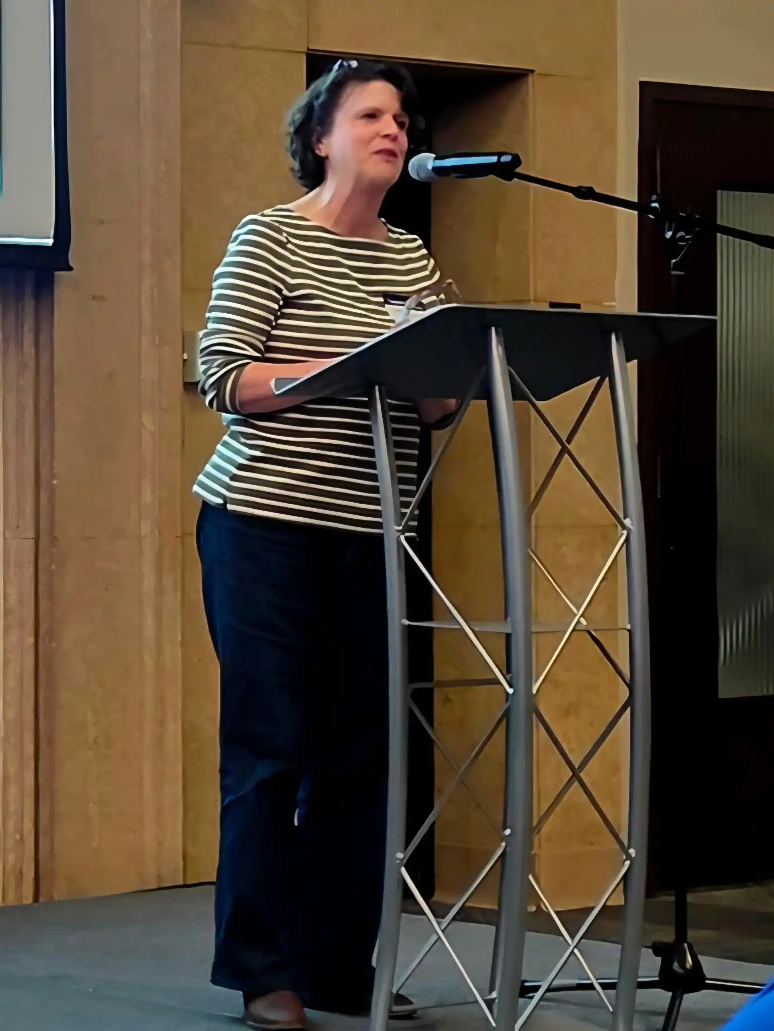 presenter standing at a podium