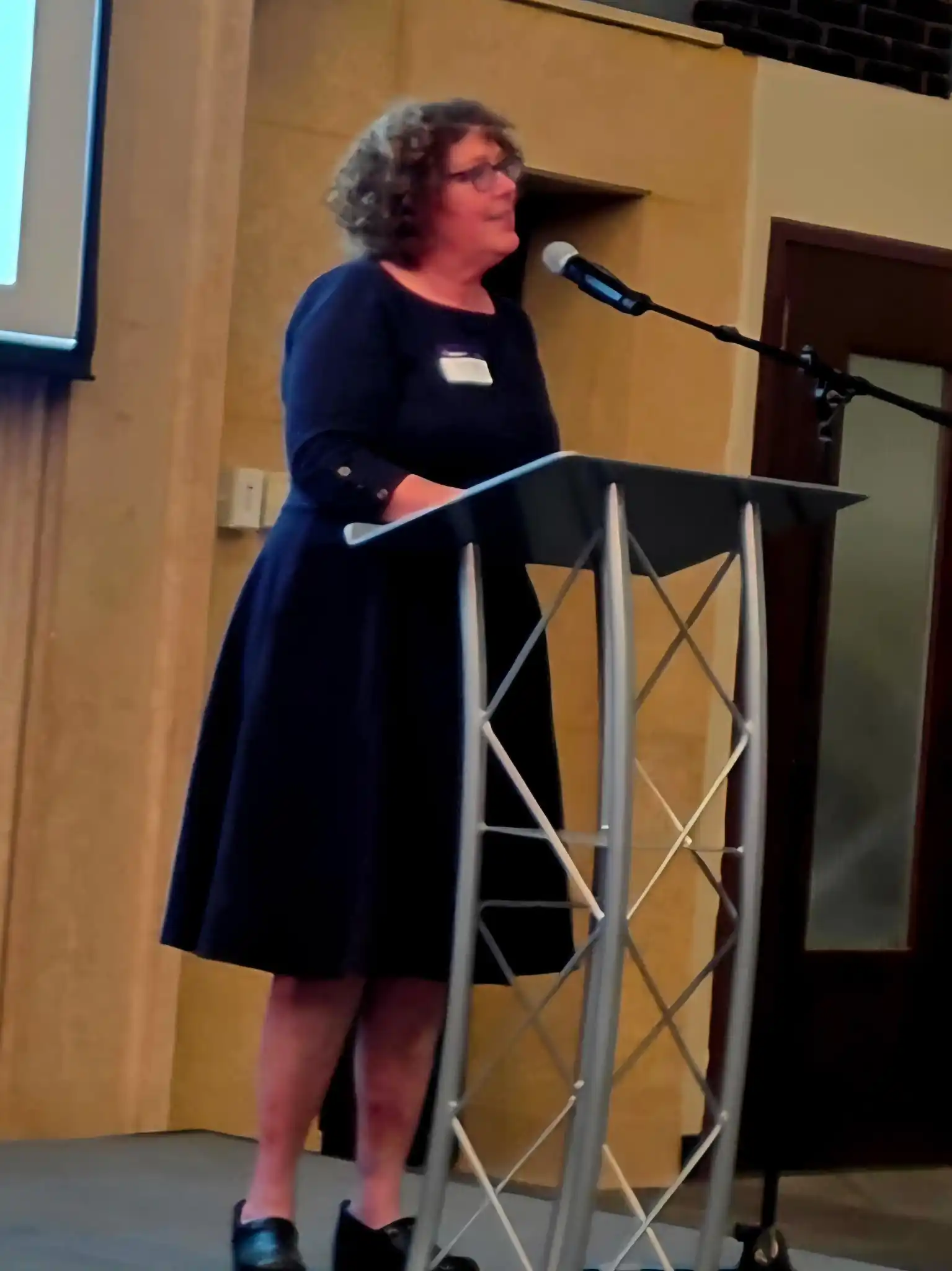 presenter standing at a podium