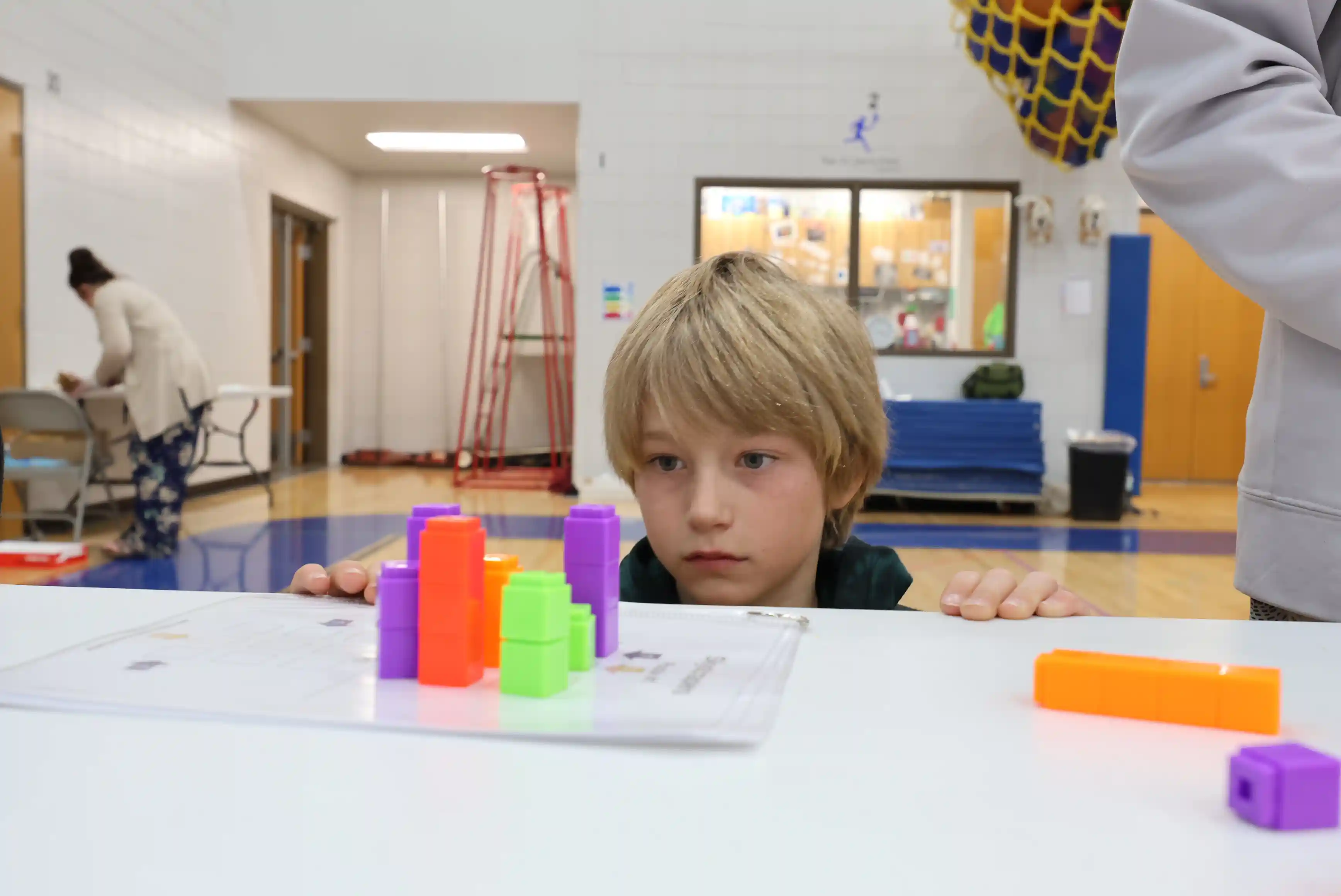 student stacking blocks
