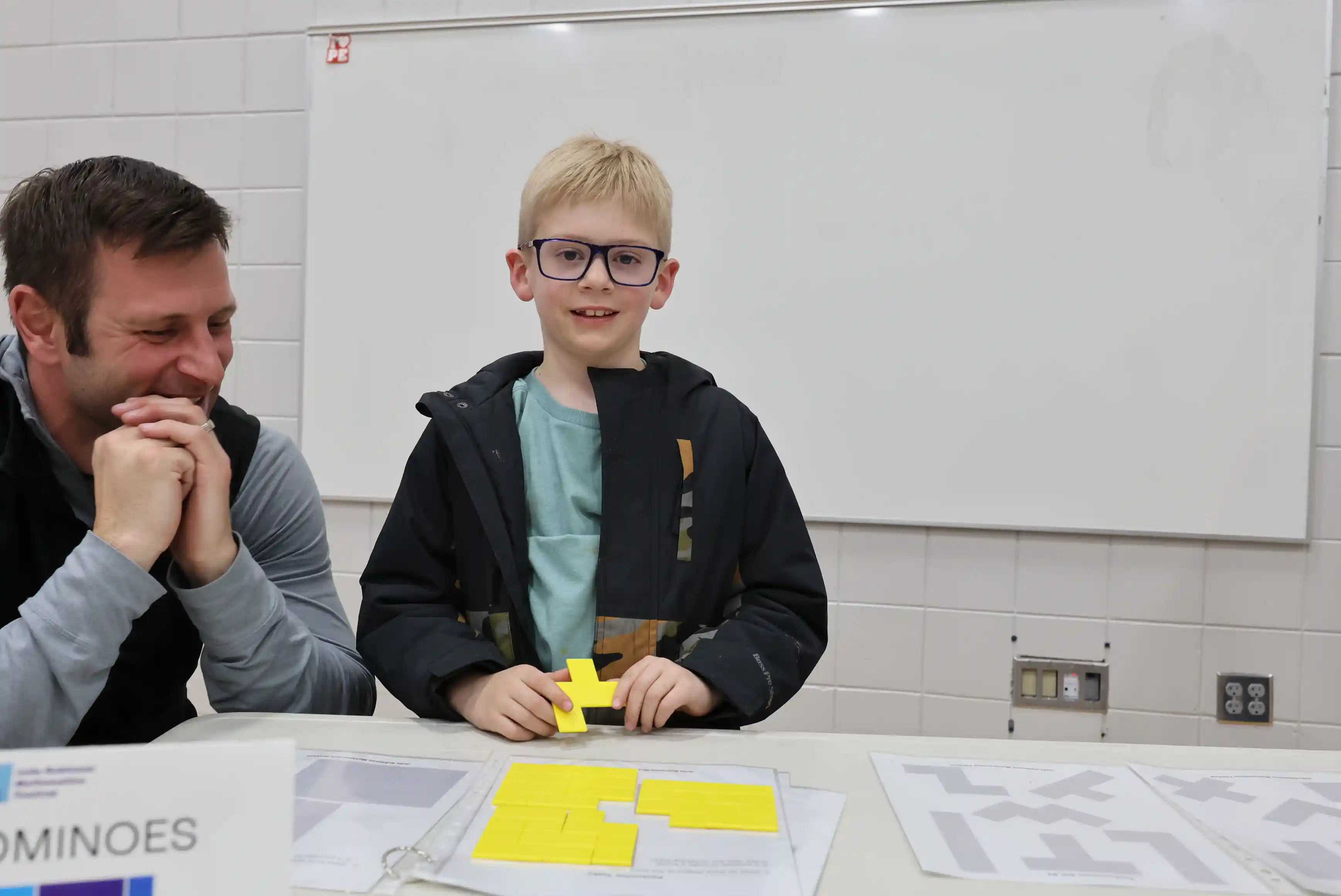 student smiling when they figured out the math problem