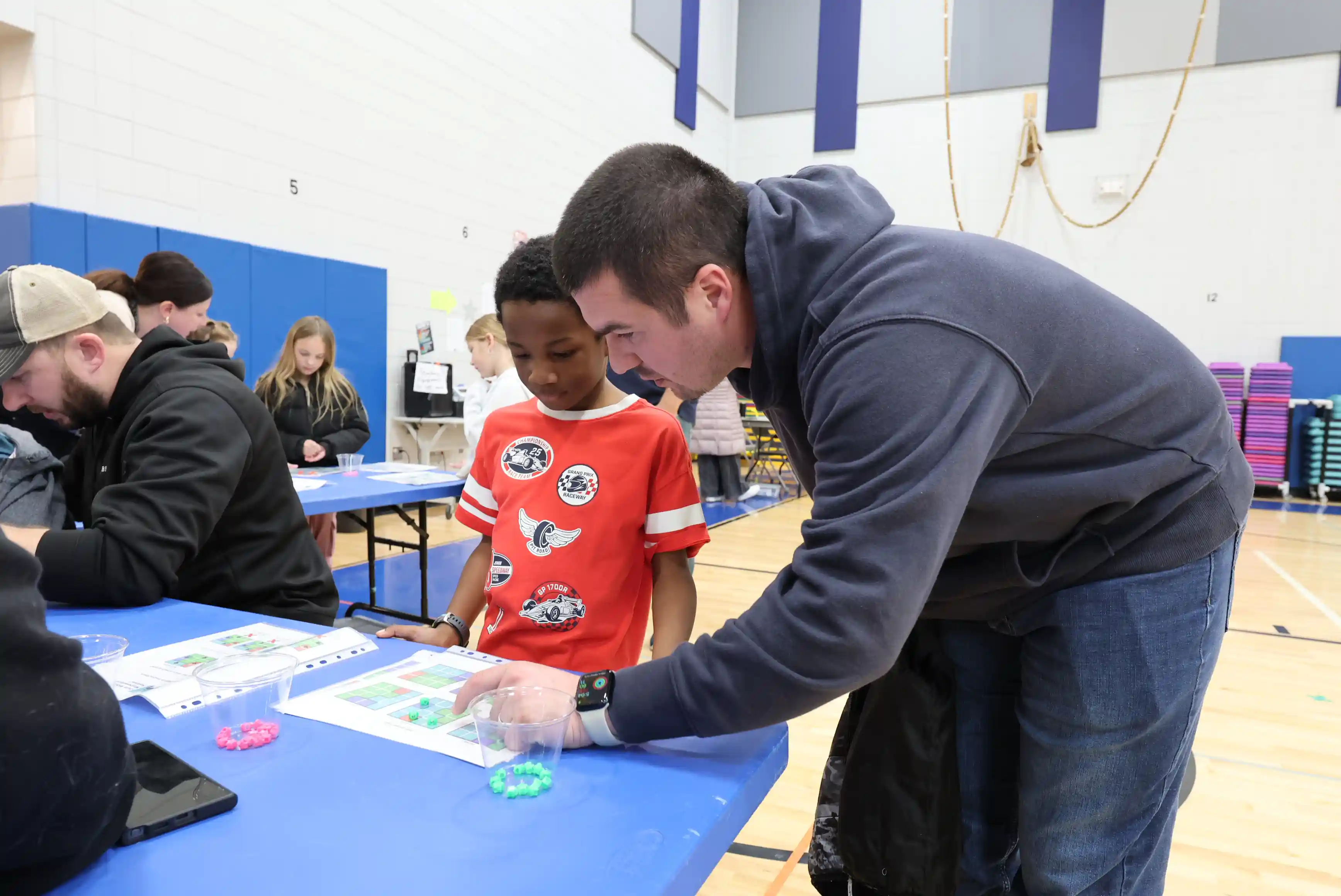 Student and adult working on a project together