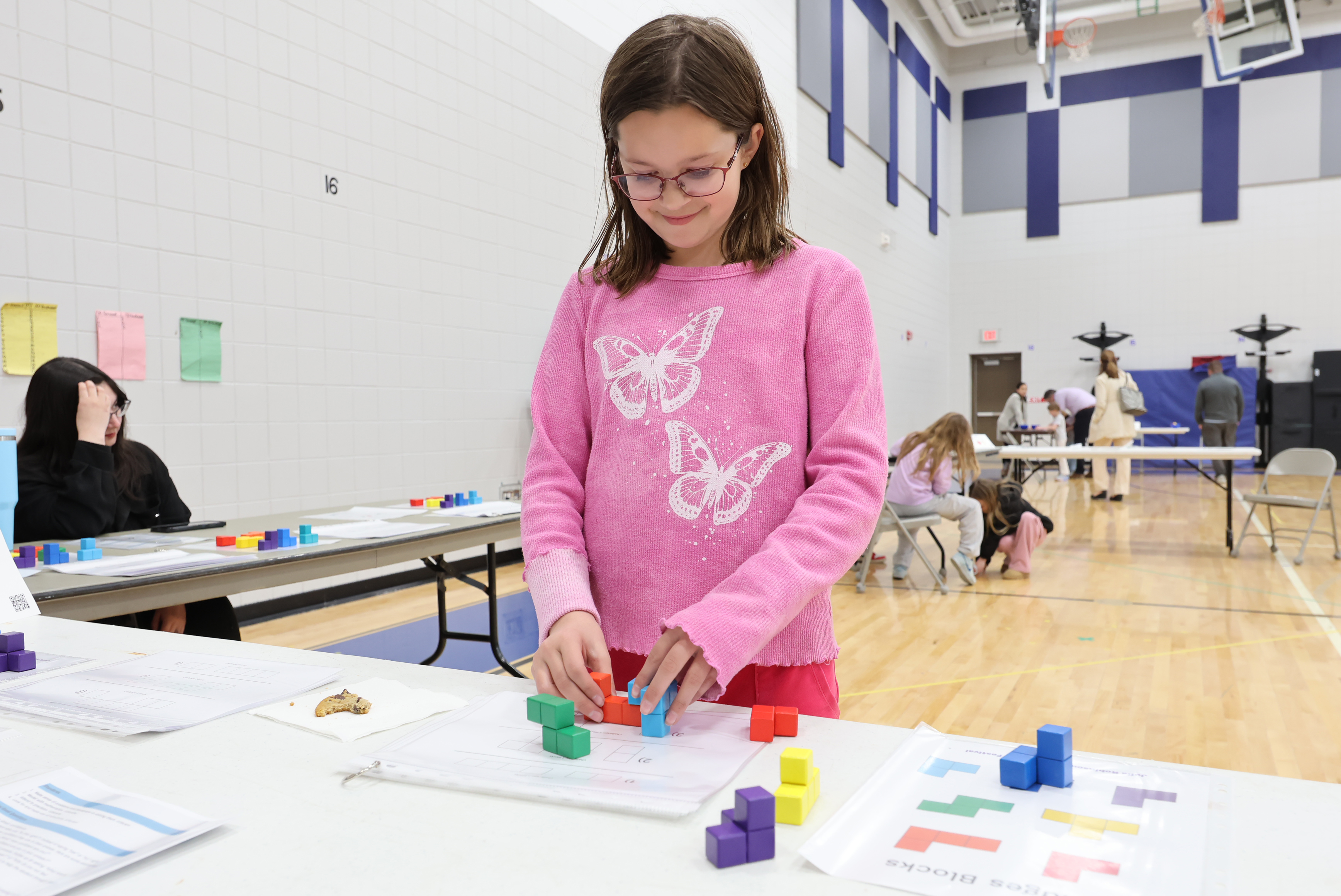 student working with blocks on a table