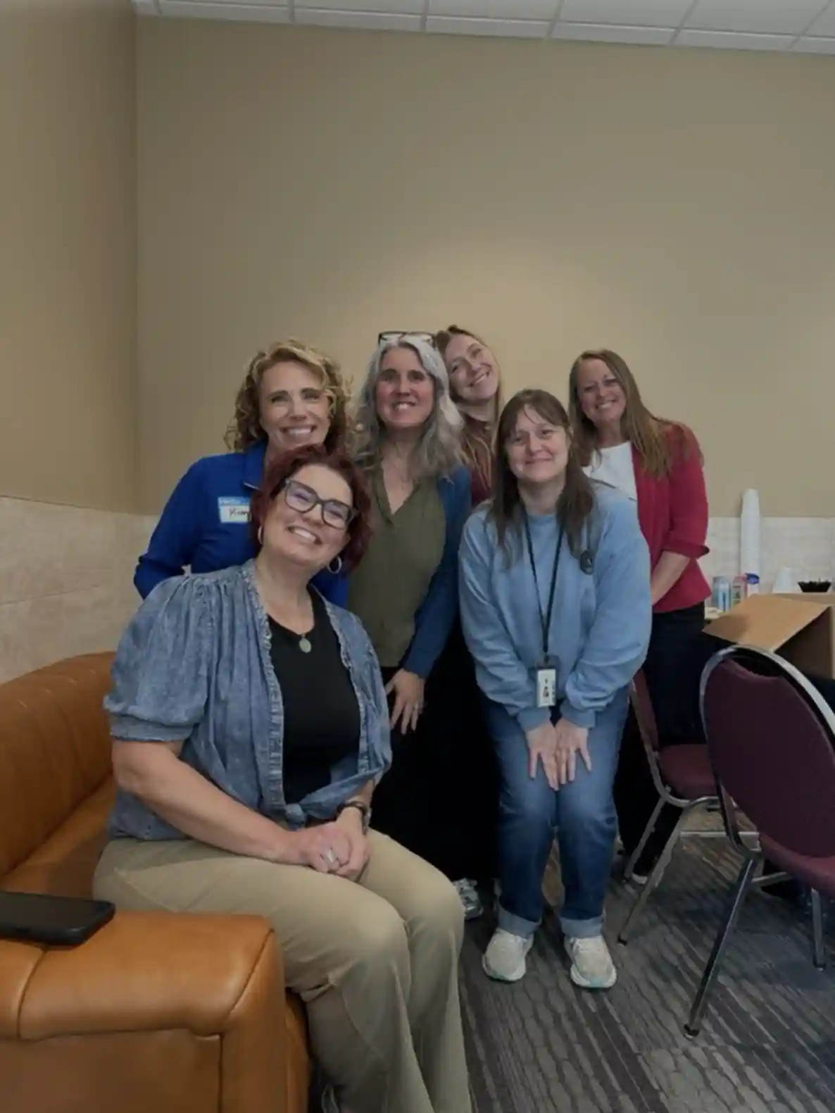Group of adults sitting and smiling