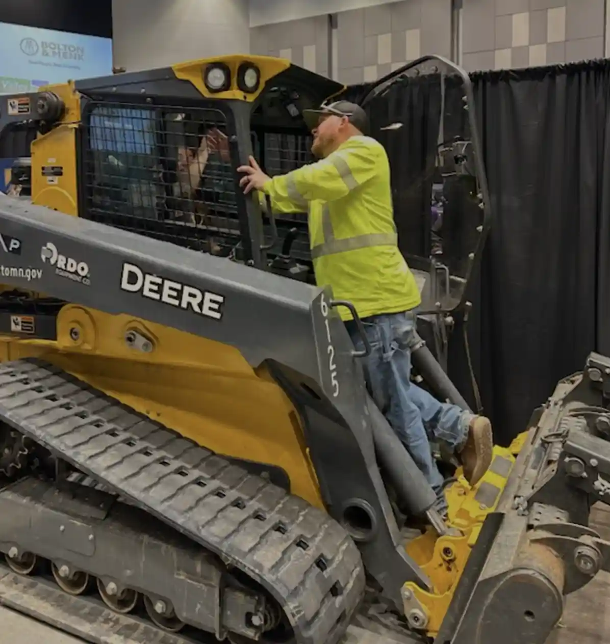 someone sitting in skid loader