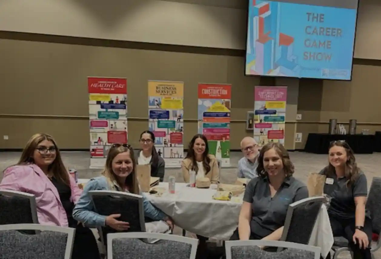 group of adults getting ready to listen to a presentation