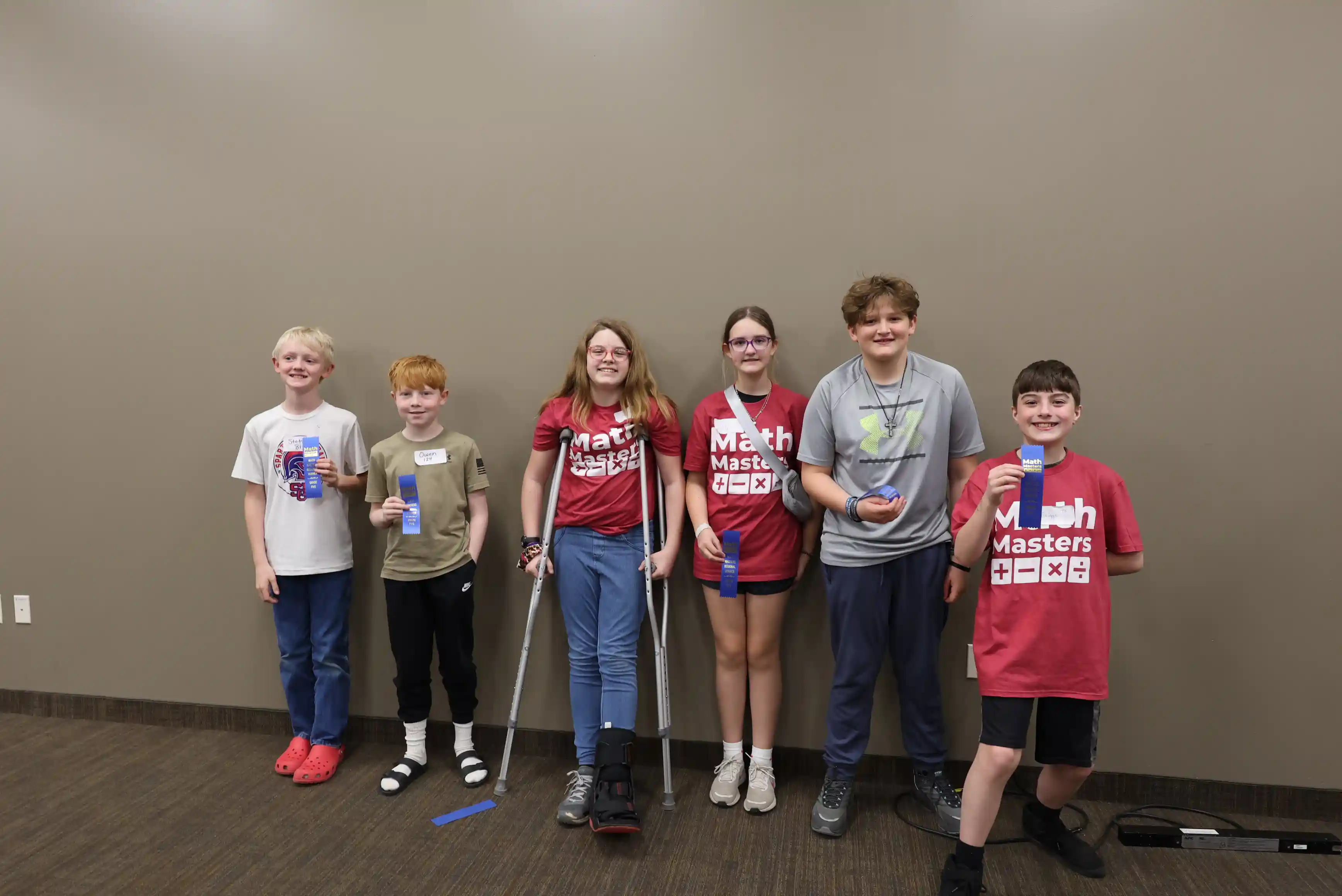 Group of student winners holding up their ribbons