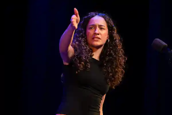 Sofia Skuza Rivera on stage reciting her poem
