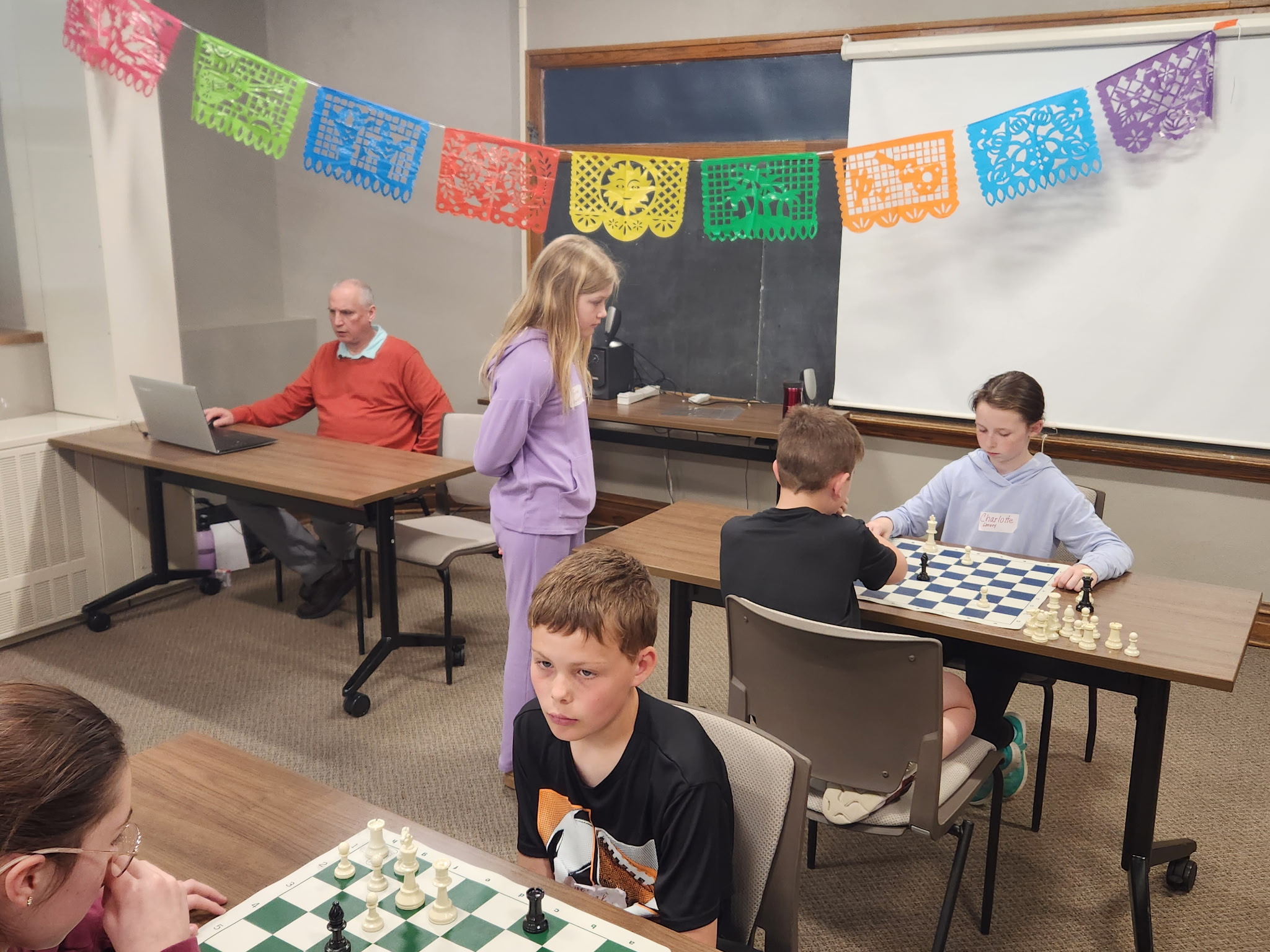 various students playing chess