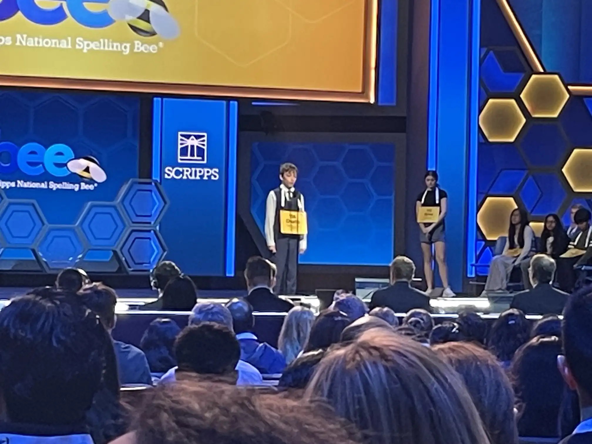 Student spelling competitor on stage