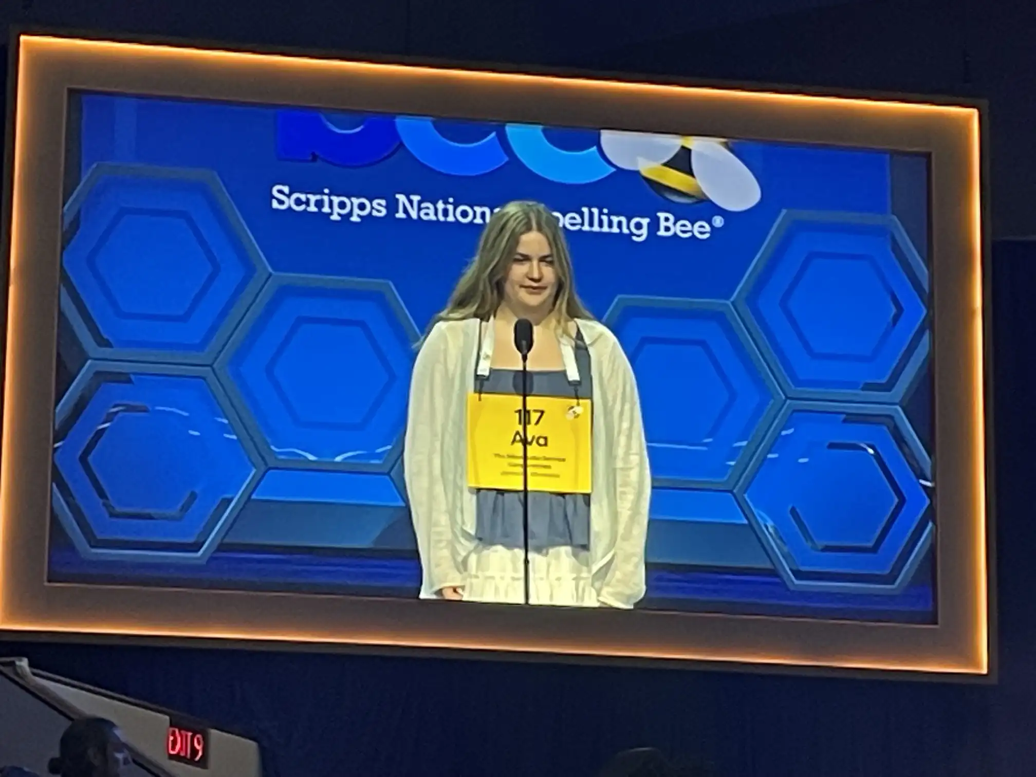 Student spelling competitor on stage