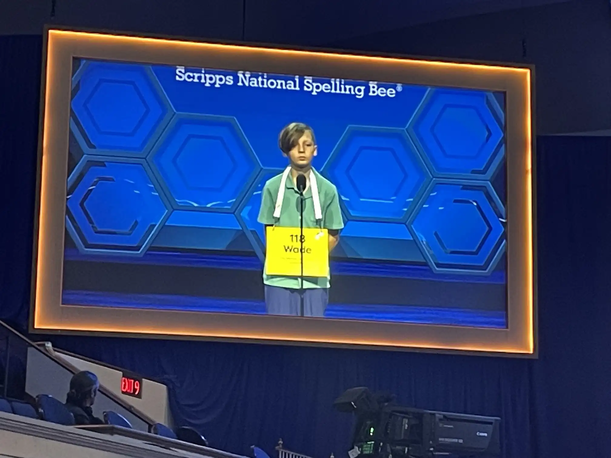 Student spelling competitor on stage