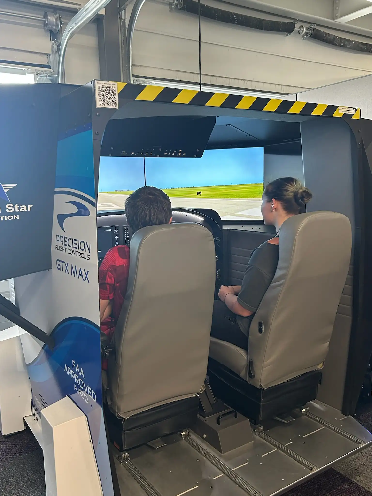 students in an airplane simulater