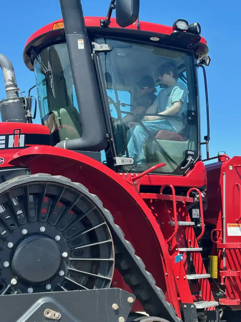 Student in a tractor