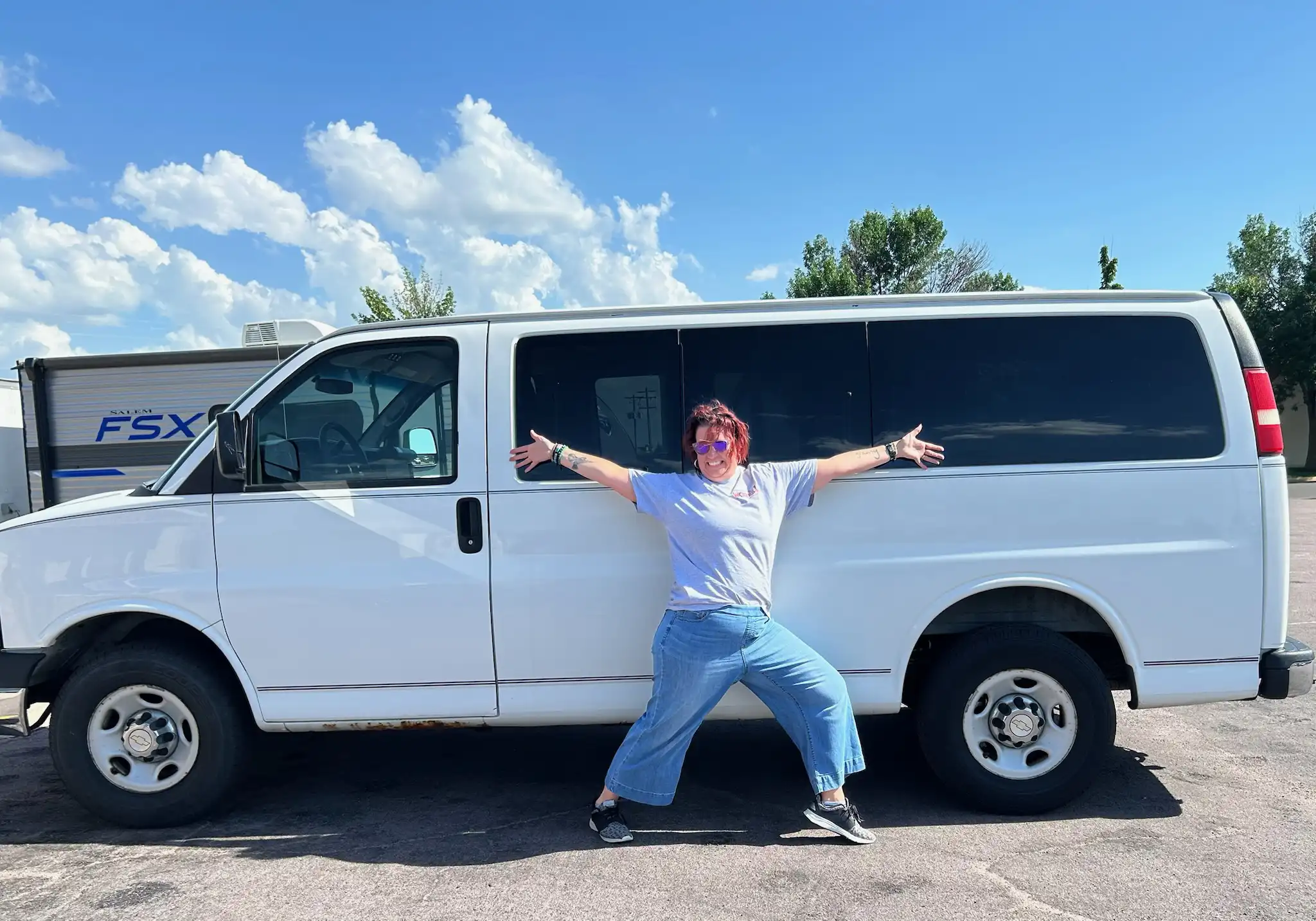 Individual standing in front of a van