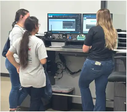 students standing by a computer