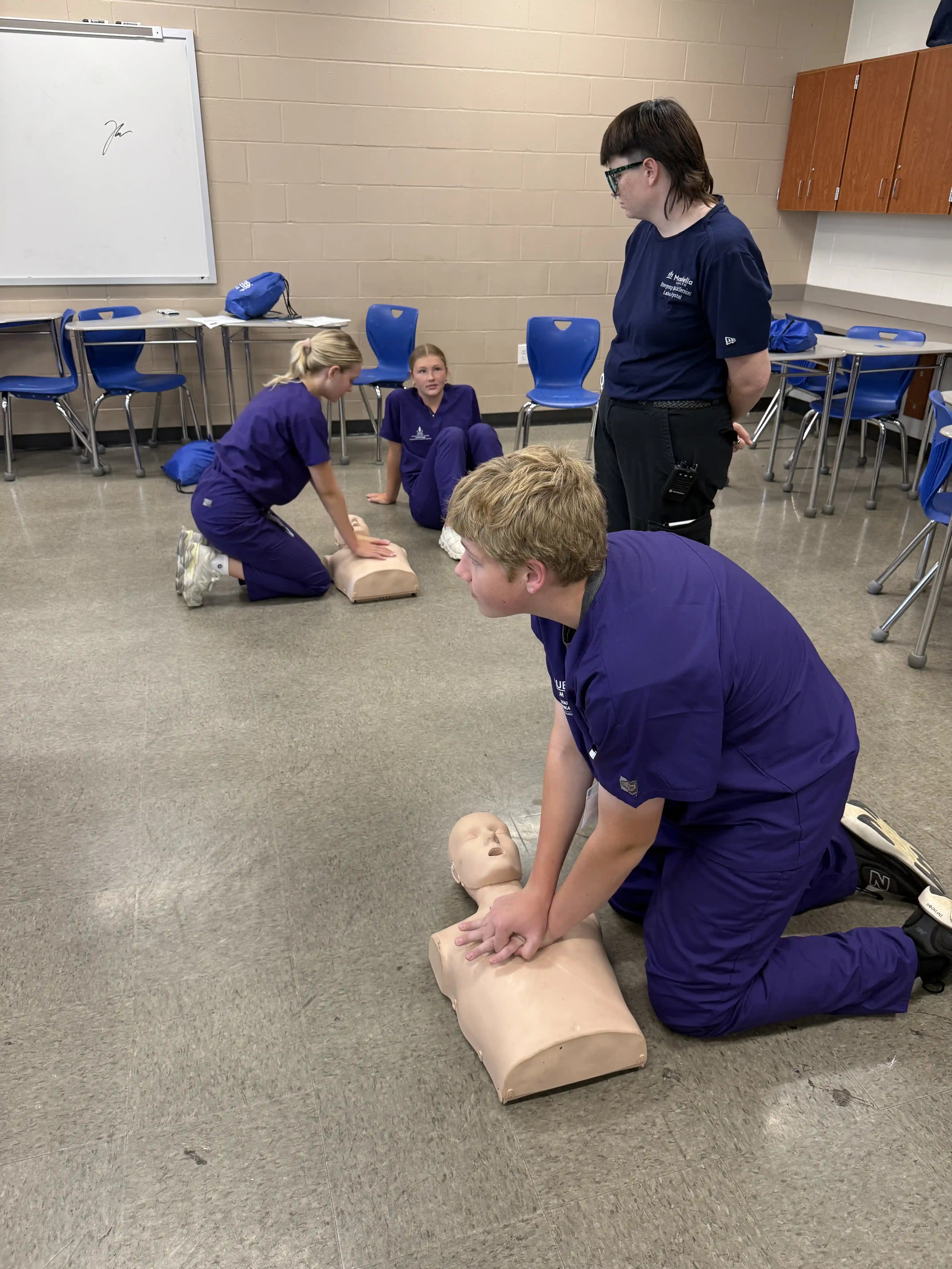 student practicing CPR