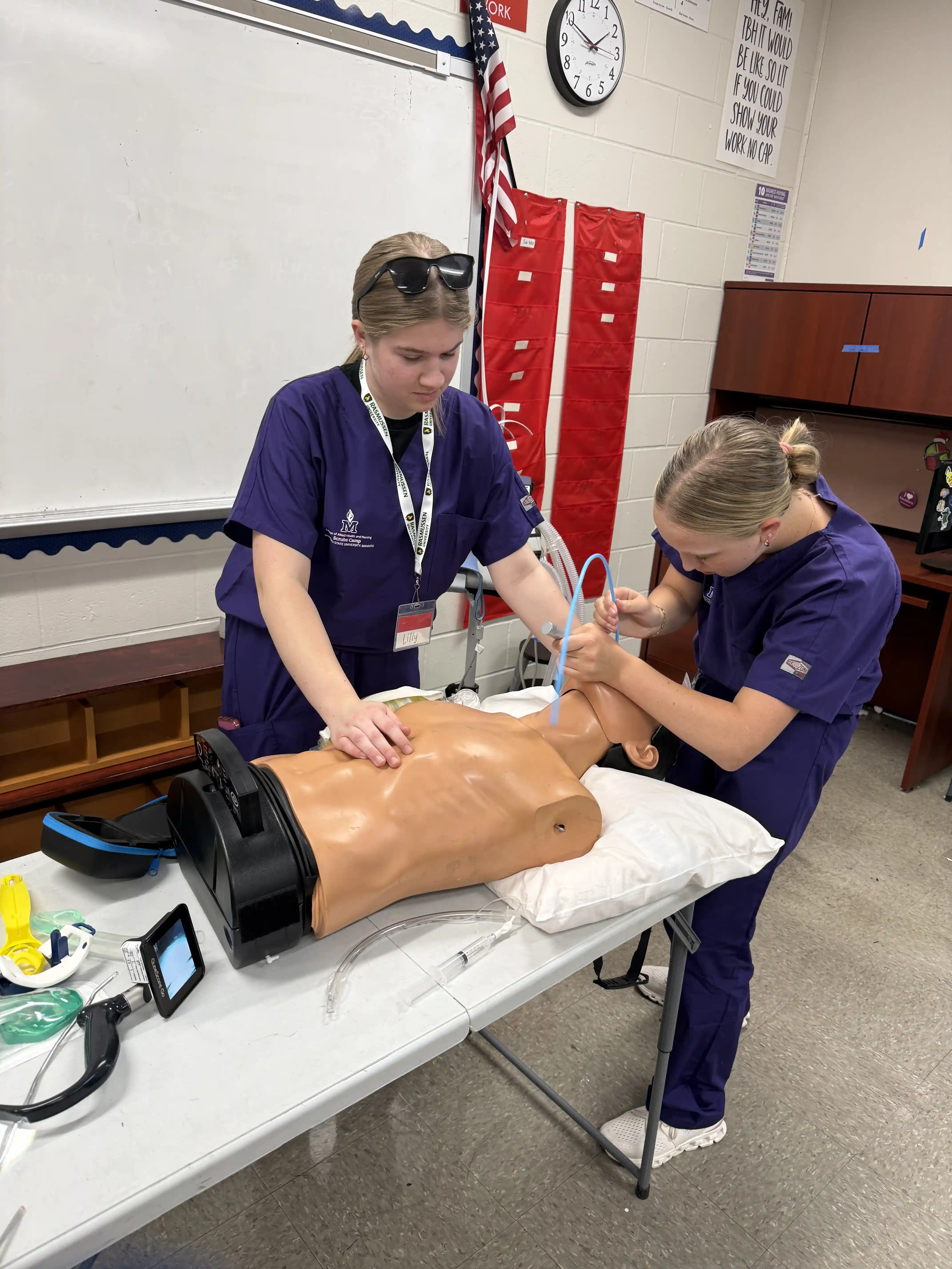 Scrubs Camp students working on a "dummy" to insert a breathing tube