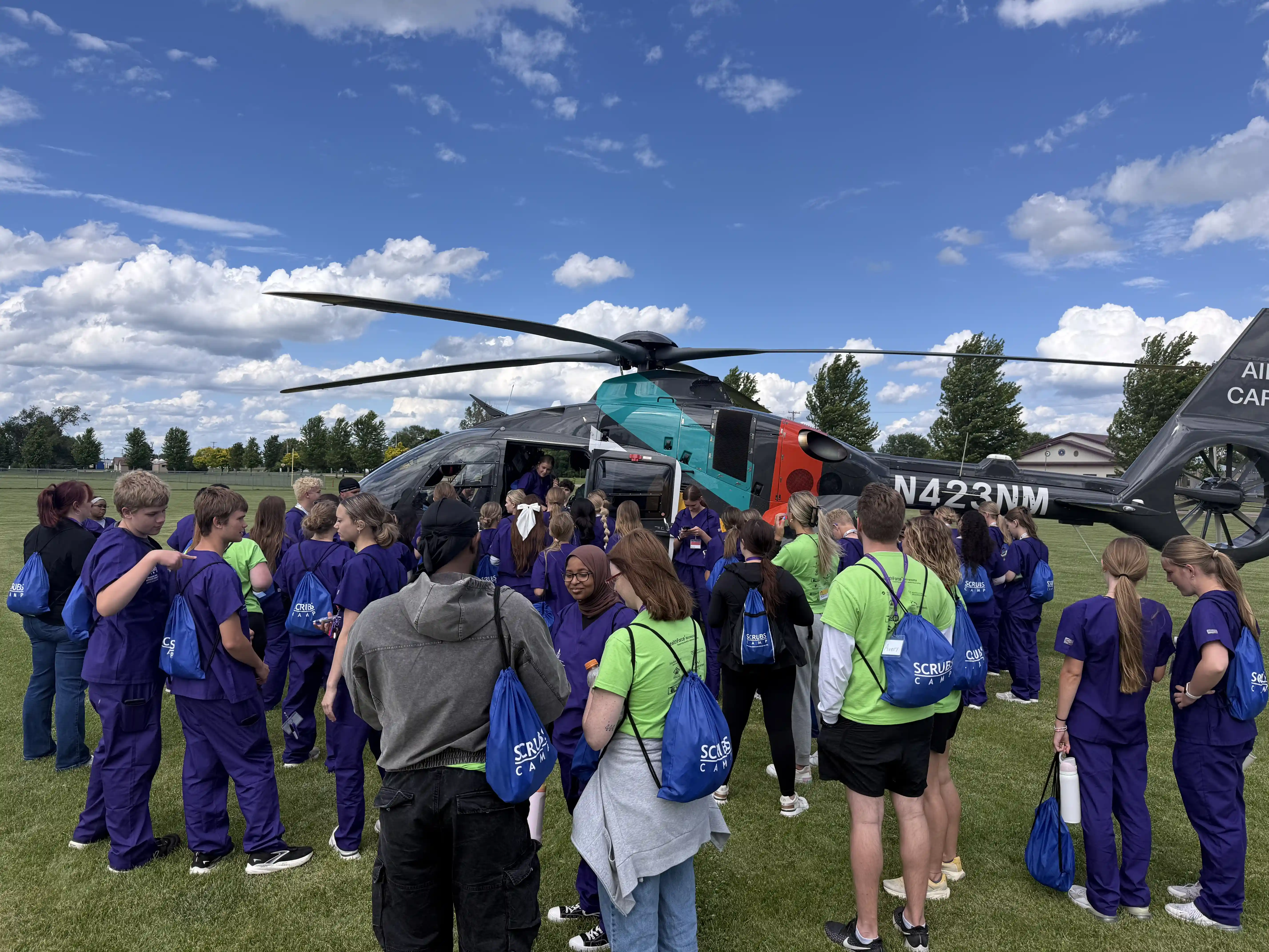 Students looking at a hospital medical helicopter
