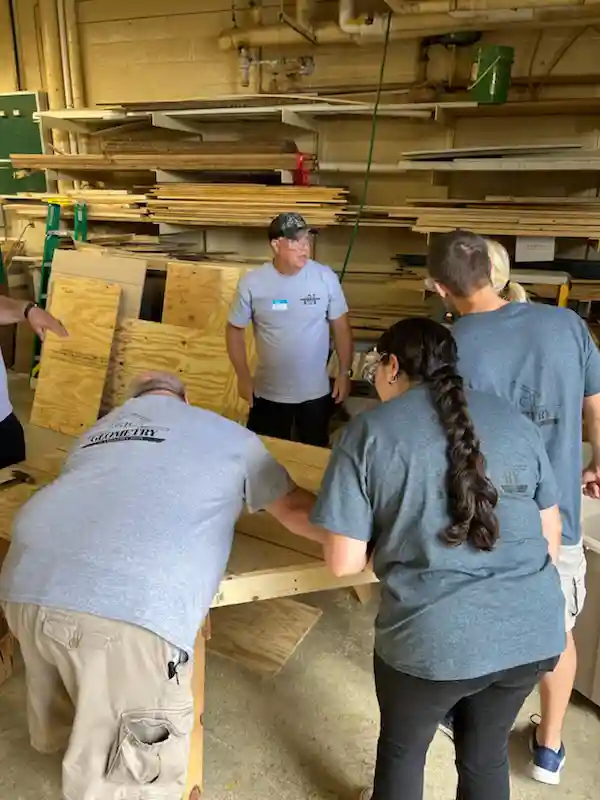Teachers in woodwork shop