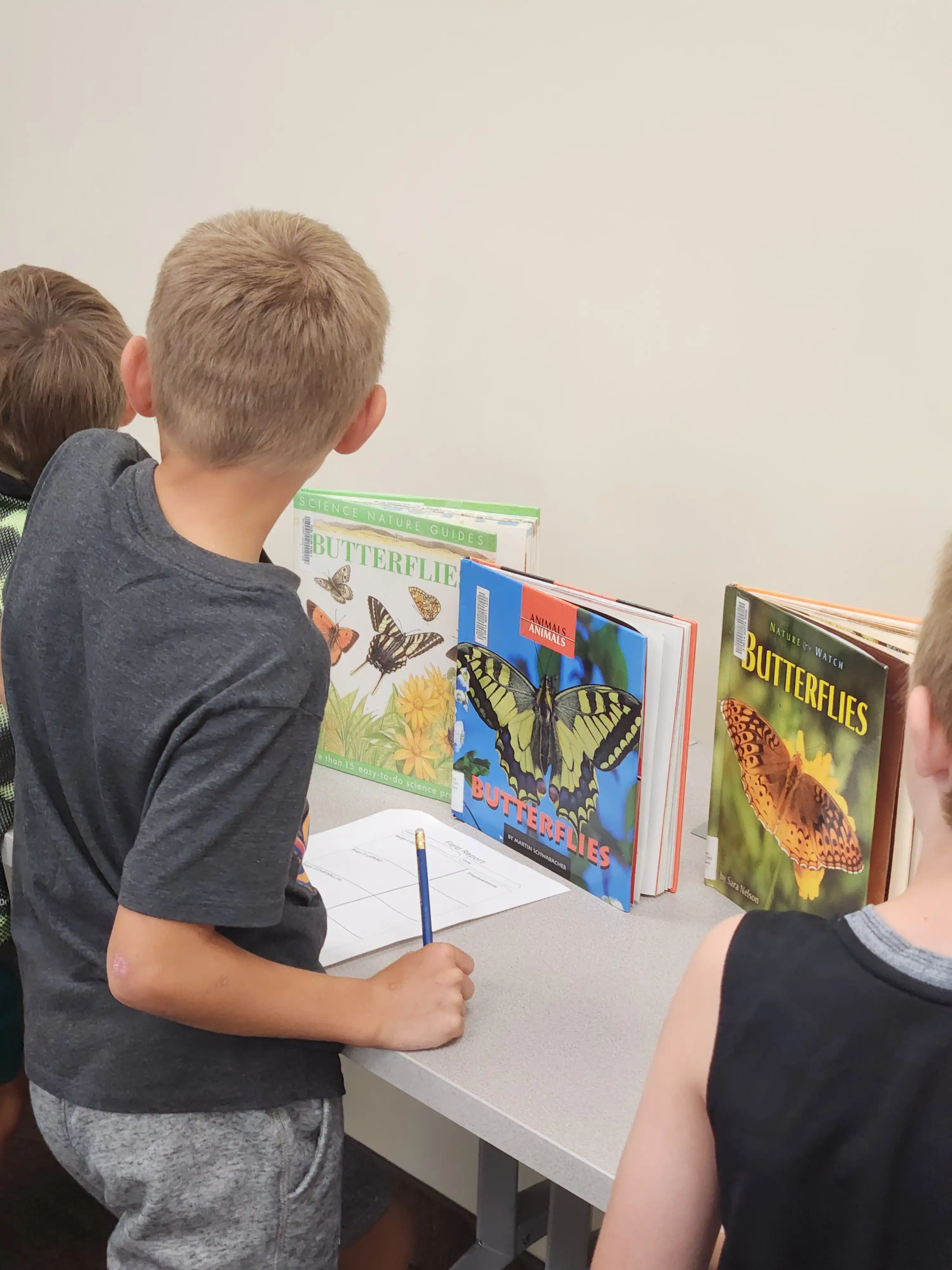 students looking at their artwork