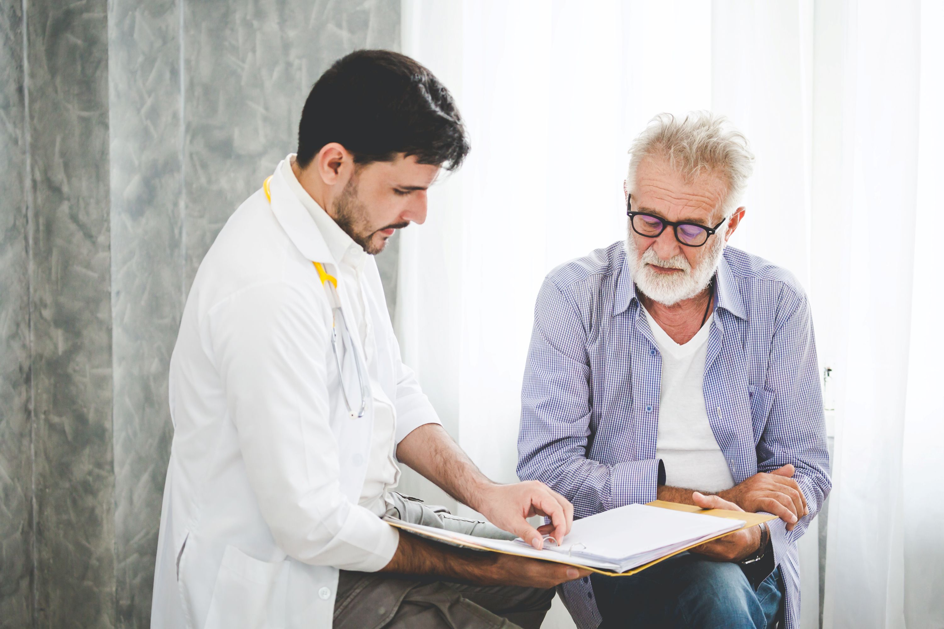 Male healthcare professional discussing with patient