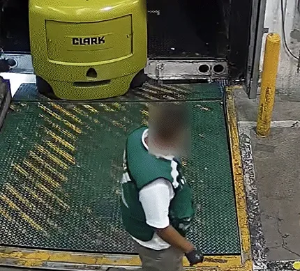Dock worker with the face blurred