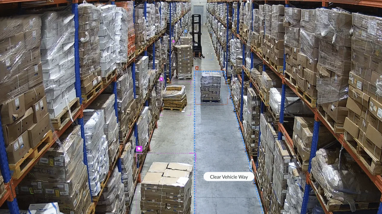 Pallets left in a warehouse aisle marked as a clear vehicle way