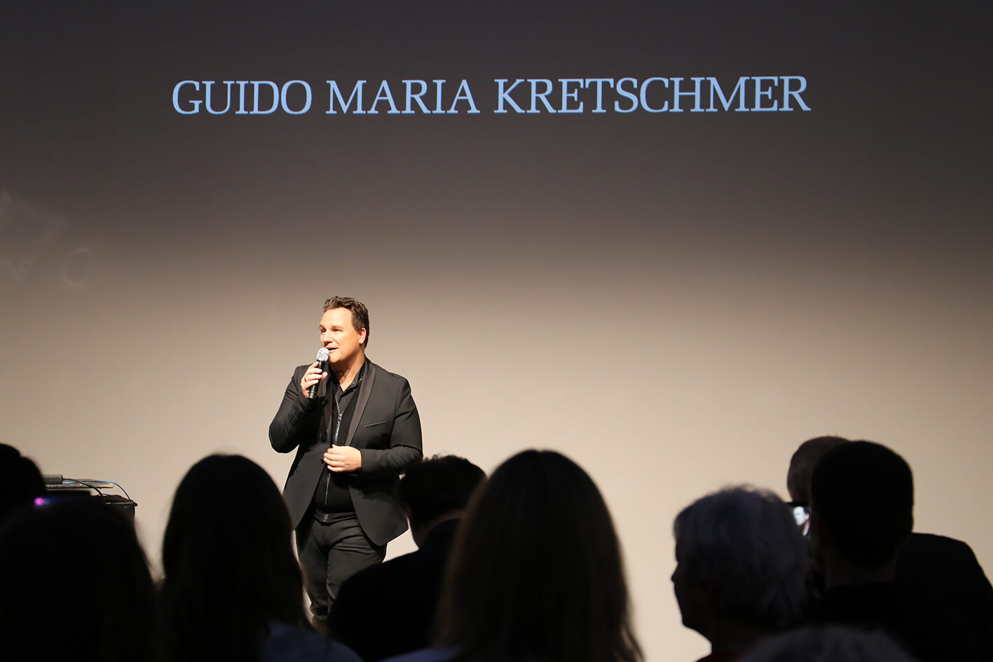 Guido Maria Kretschmer speaking on the GMK convention.