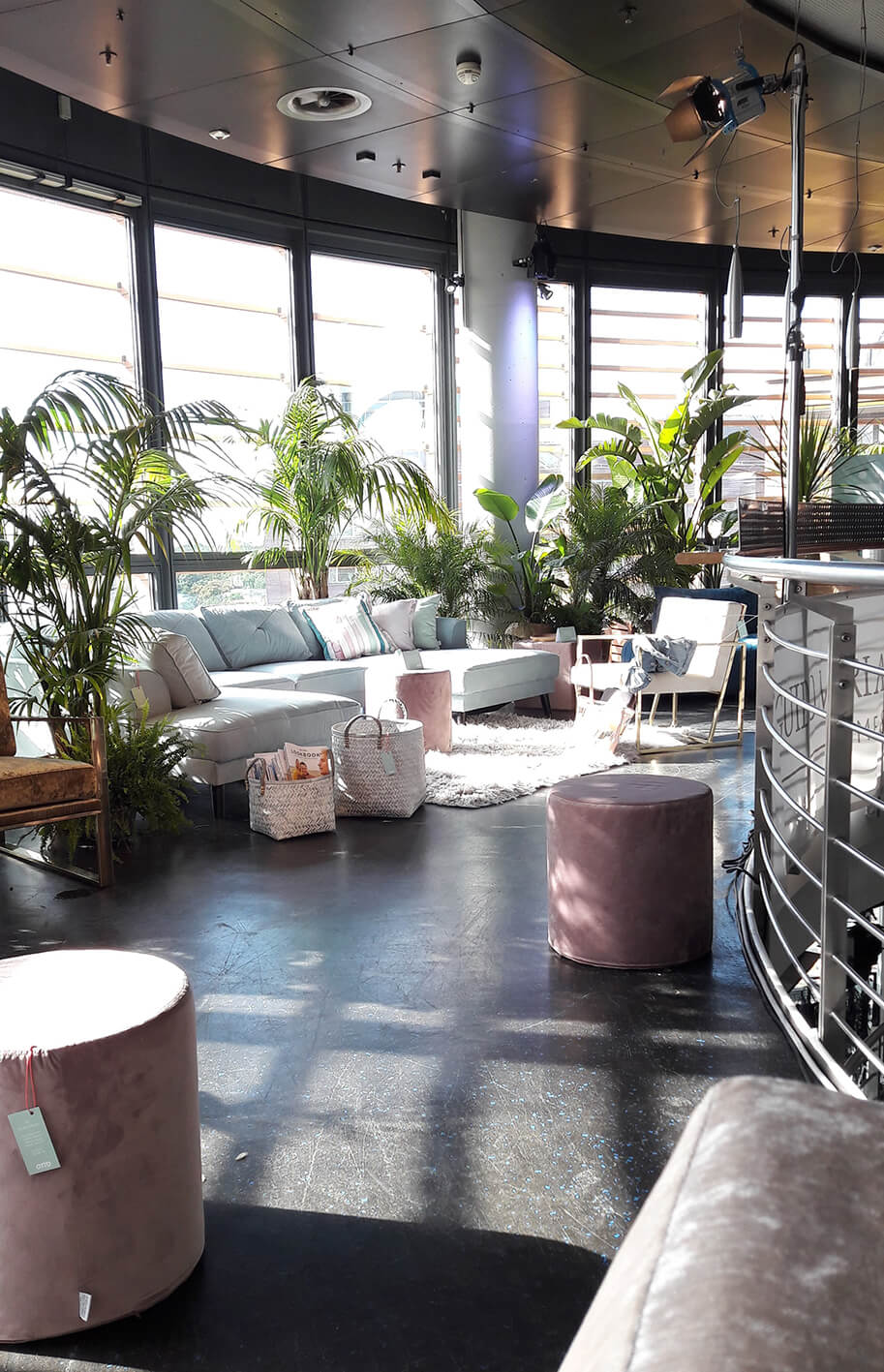 Beautiful design loft with large windows and plants.