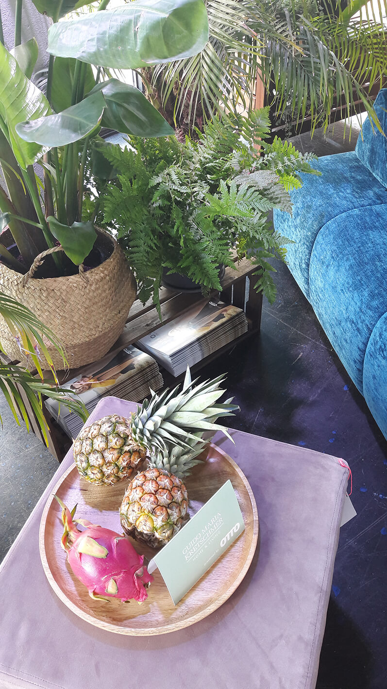 A bowl of fruits on a coffee table. 