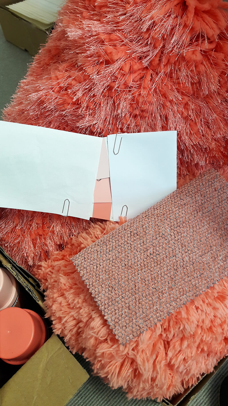 Pieces of paper on a pink fur.