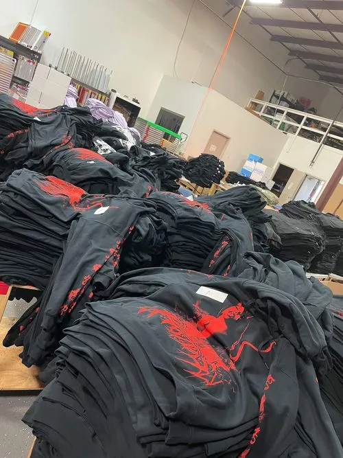 industrial screen printing production line in action, workers processing bulk orders