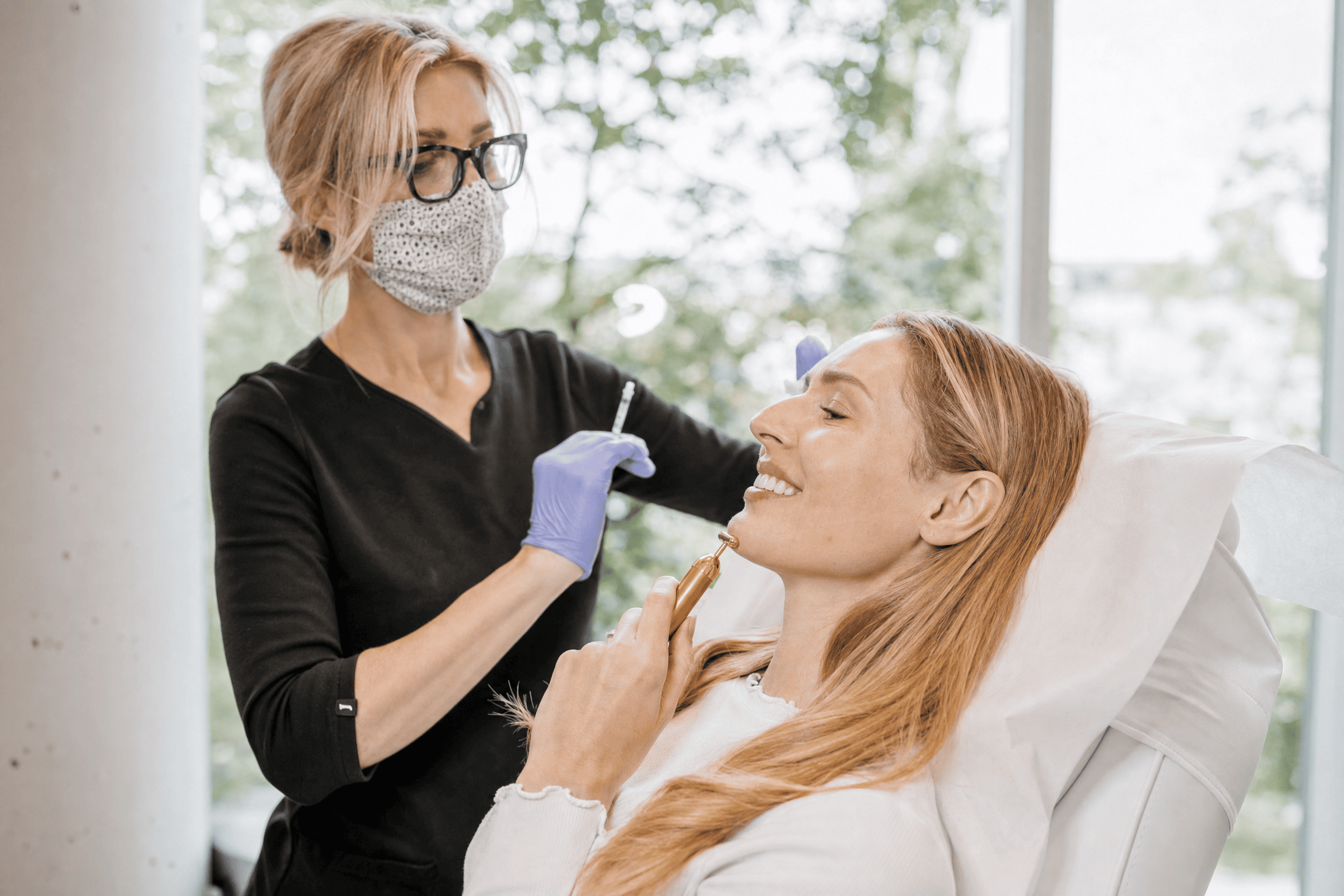 Medical-aesthetic provider consulting with a patient at 8 West Clinic