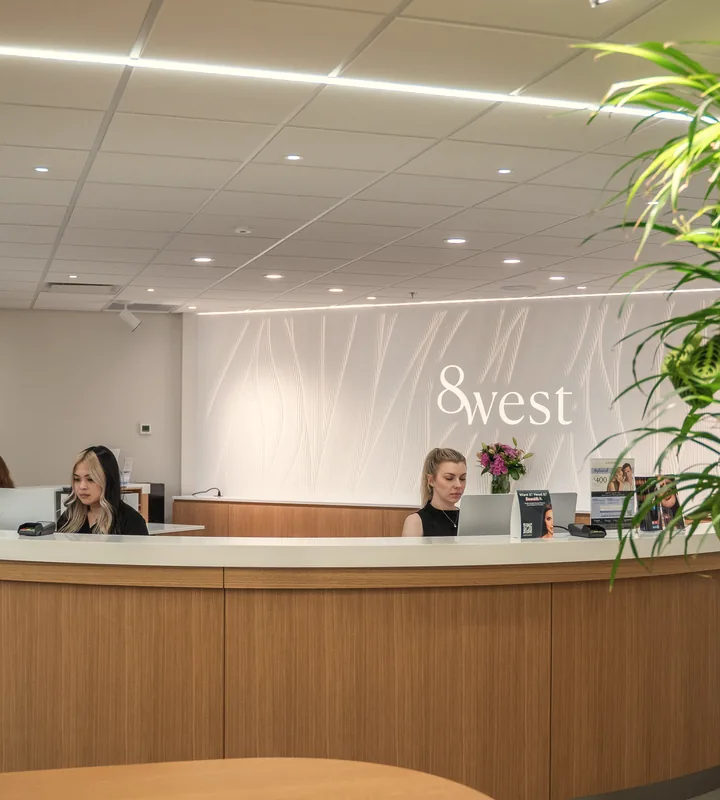 The 8 West reception desk with our front desk team