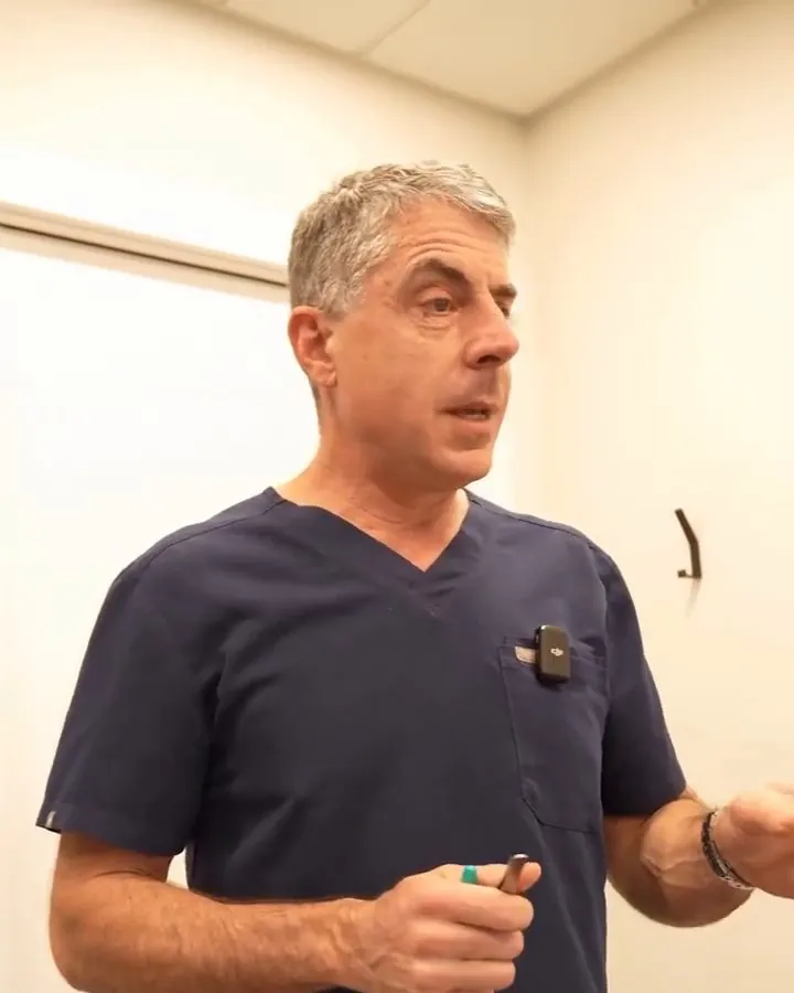 Dr. Buonassisi in a consultation room, explaining a plan