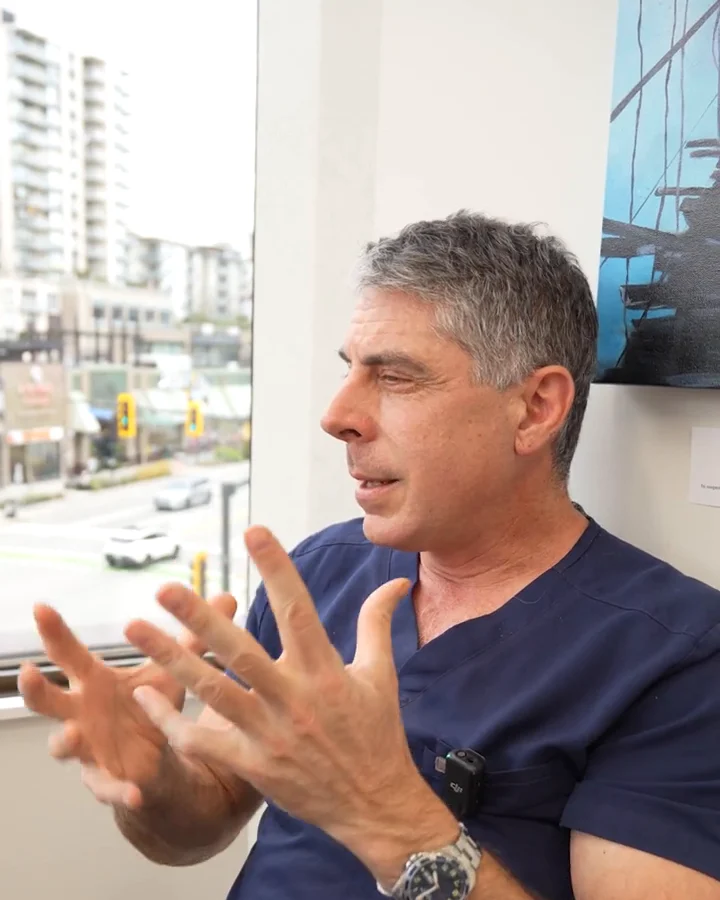 Dr. Buonassisi explaining with his hands how surgery repositions tissue