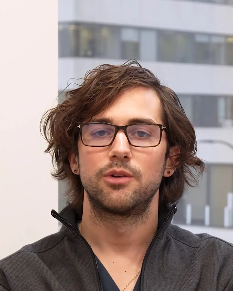 Dr. Masschelein in his office, answering a question about breastfeeding