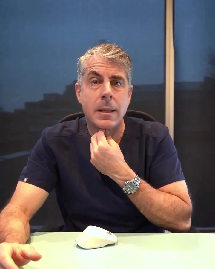 Dr. Buonassisi at his desk, talking about facelift results