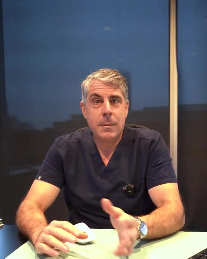 Dr. Buonassisi at his desk, talking with his hands