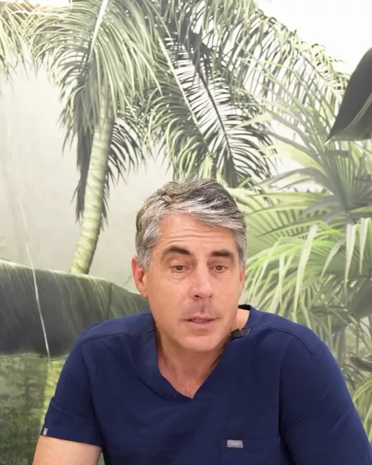 Dr. Buonassisi in the clinic, talking about lower eyelid surgery