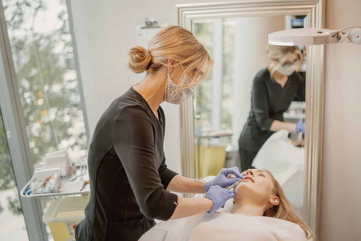 Lisa, RN, giving an injectable treatment at 8 West Clinic