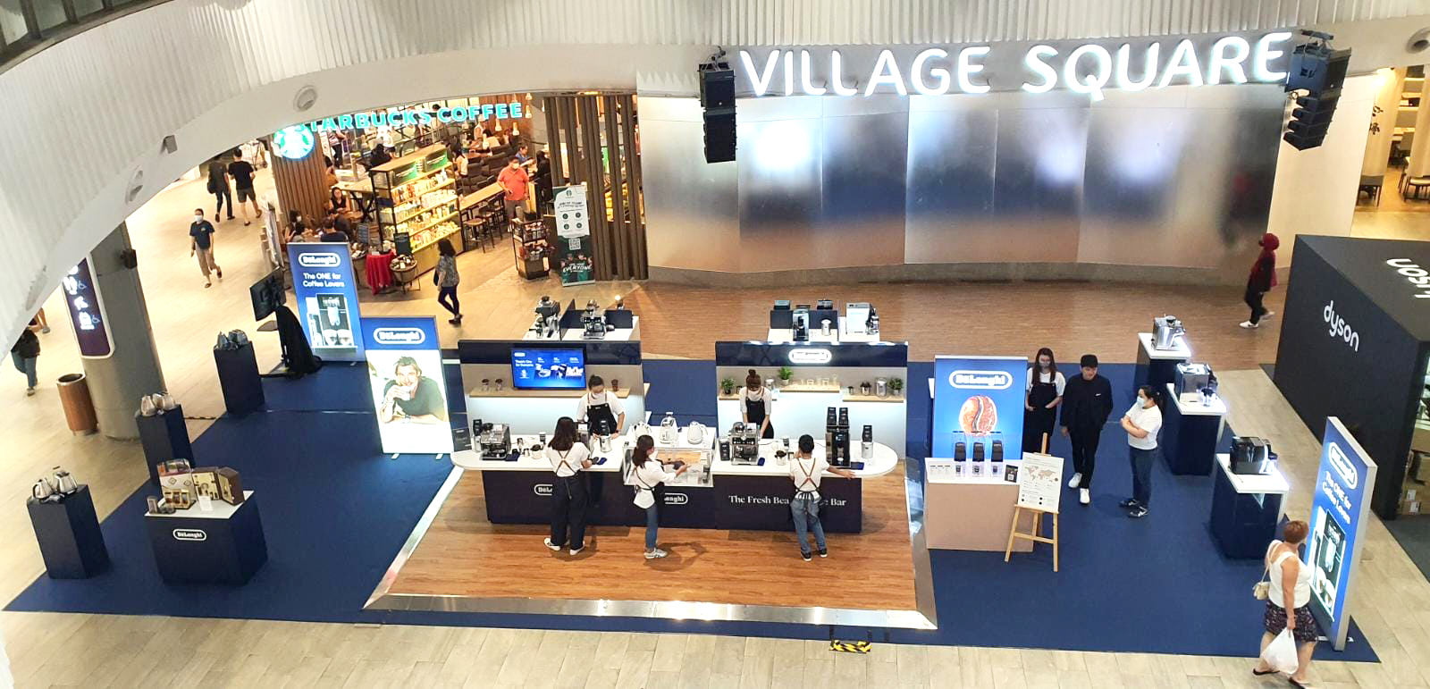 Bird's eye view of a long stretch pop-up event at a mall.