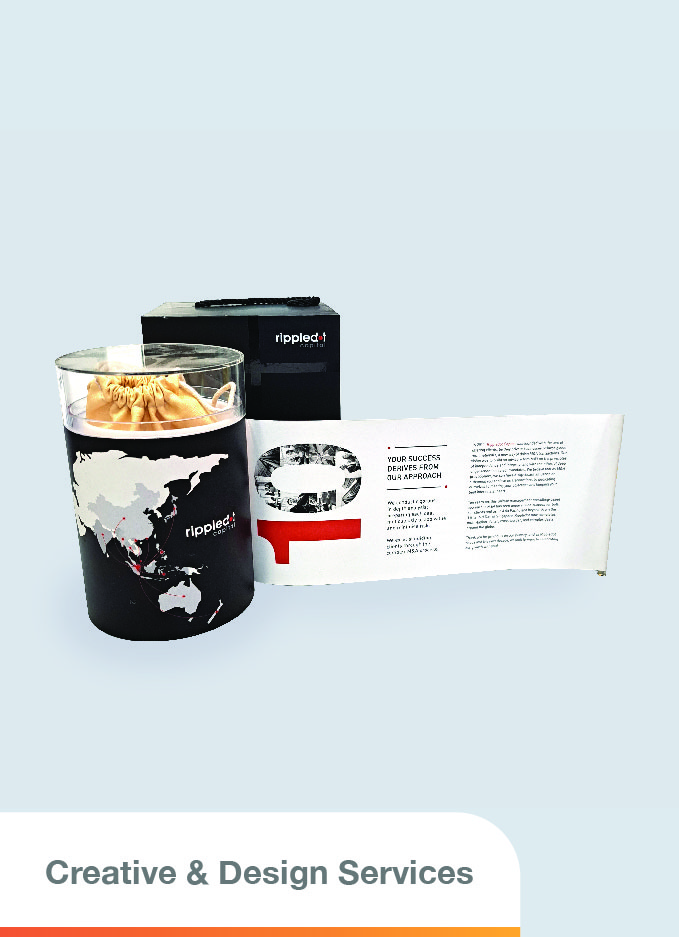 A cylindrical packaging design featuring a black exterior with a map illustration, topped with a transparent cap. It includes a scroll that can be extended from the side to reveal its contents
