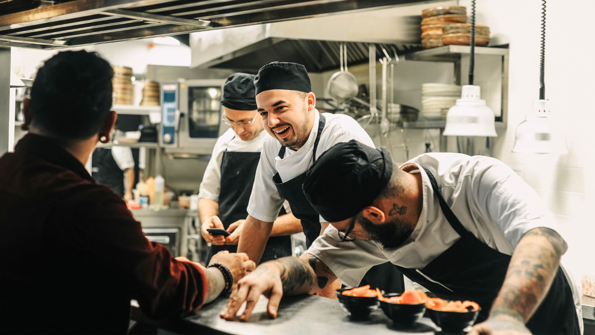 Team of chefs working in a shared commercial kitchen space in the UK