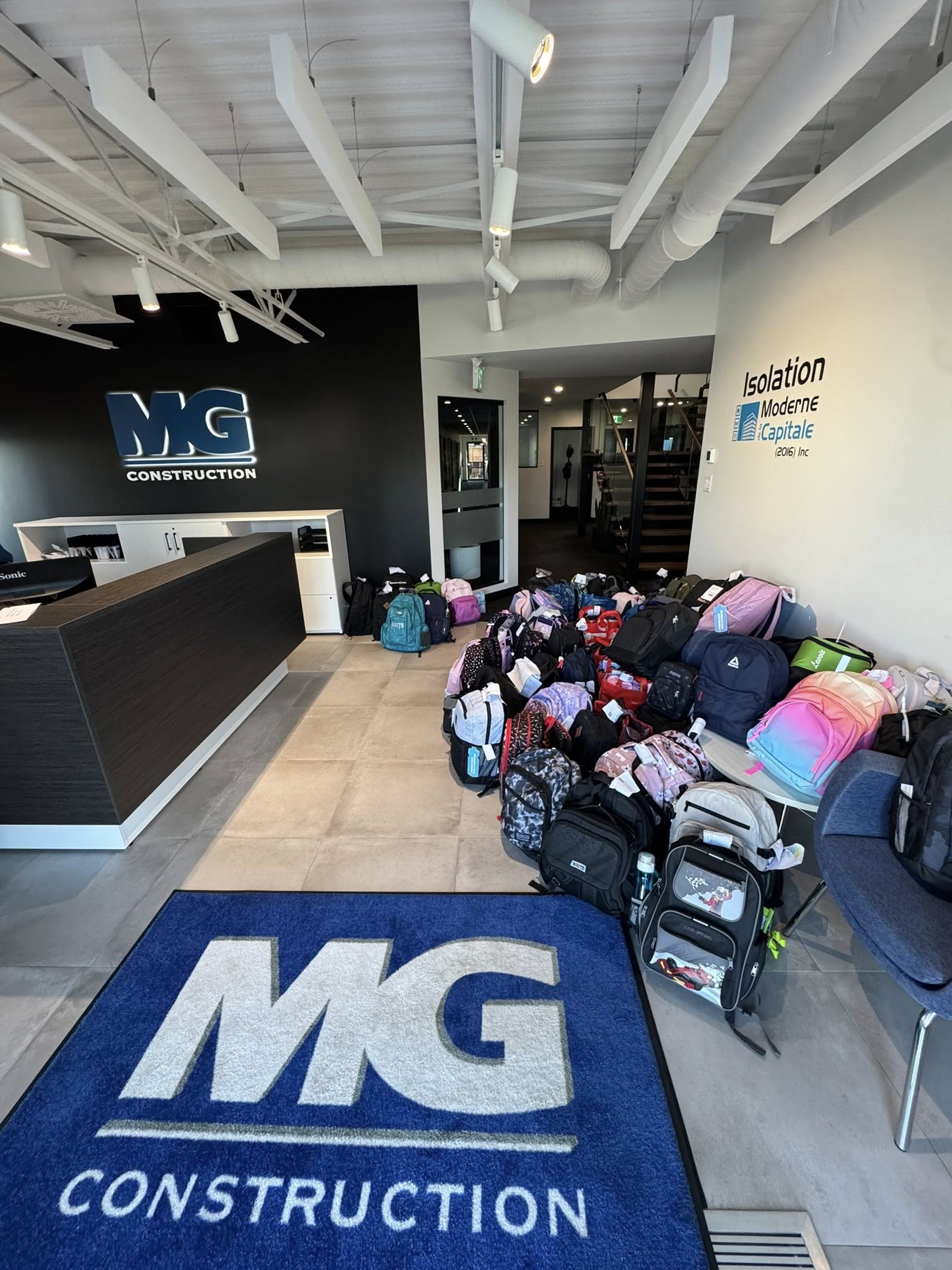 a pile of bags being delivered at a school
